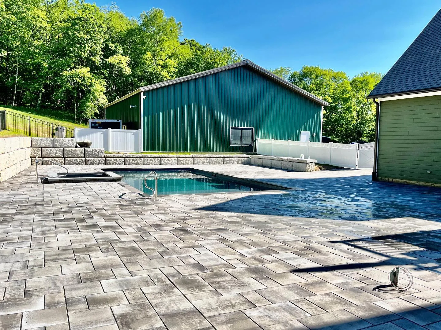 Paver pool deck and patio built by Decorative Concrete of Connecticut