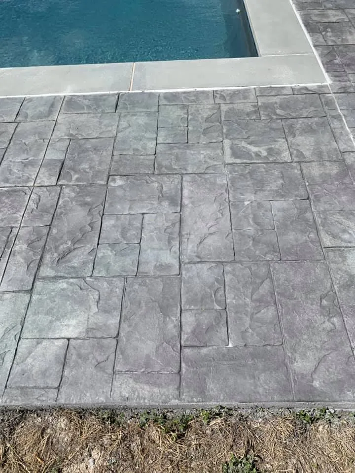 Square stamped concrete pool deck in Connecticut